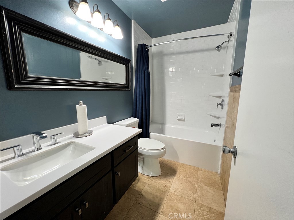 22031 Main, Unit 10 Carson, CA 90745 - Photo 8 of 10 a bathroom with a sink a toilet and shower