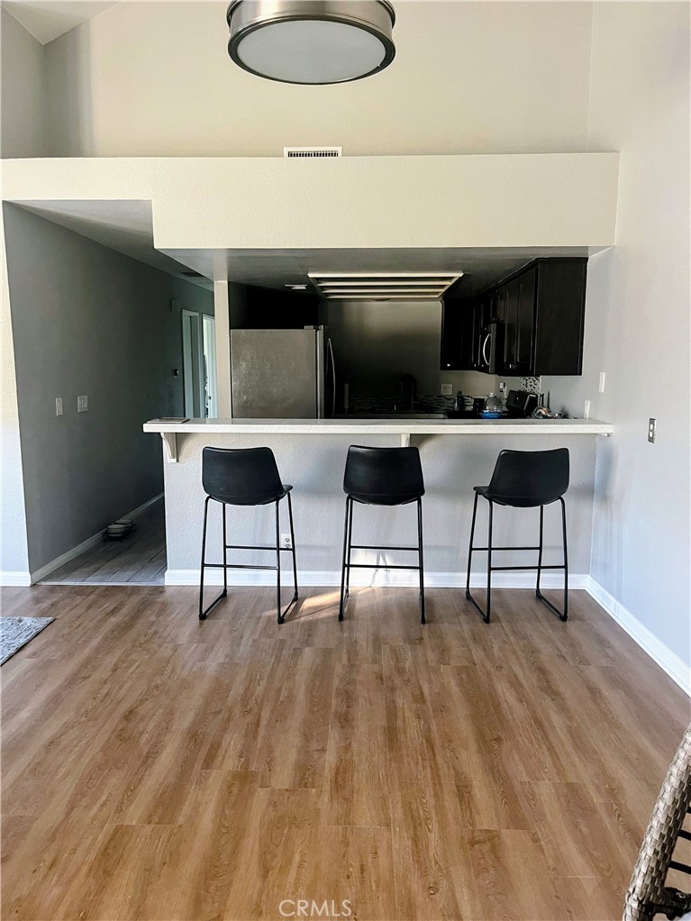 22031 Main, Unit 10 Carson, CA 90745 - Photo 10 of 10 a living room with furniture and a flat screen tv