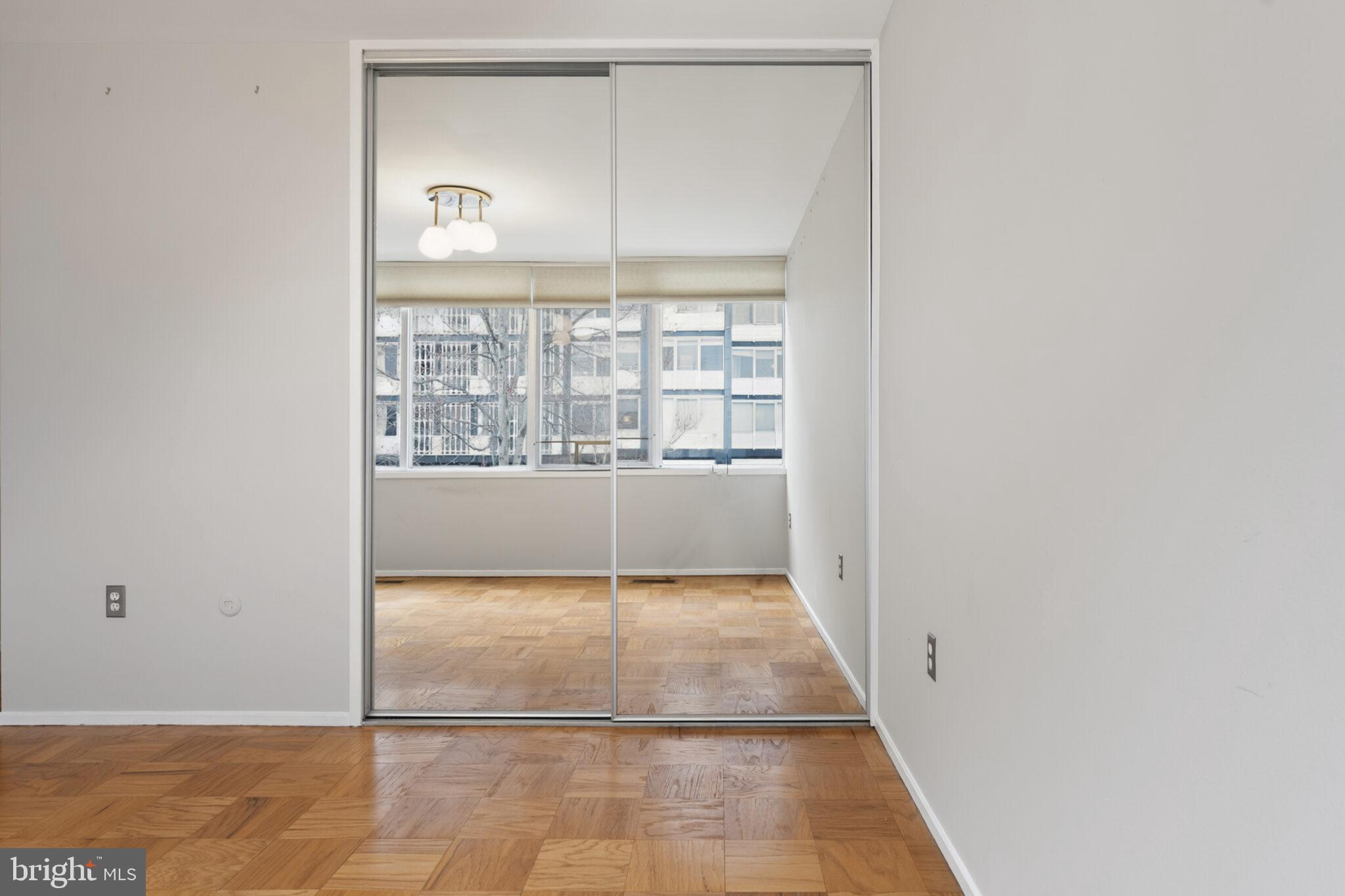 302 N Street Southwest, Unit 302 Washington, DC 20024 - Photo 20 of 68 a view of a room with wooden floor and a window