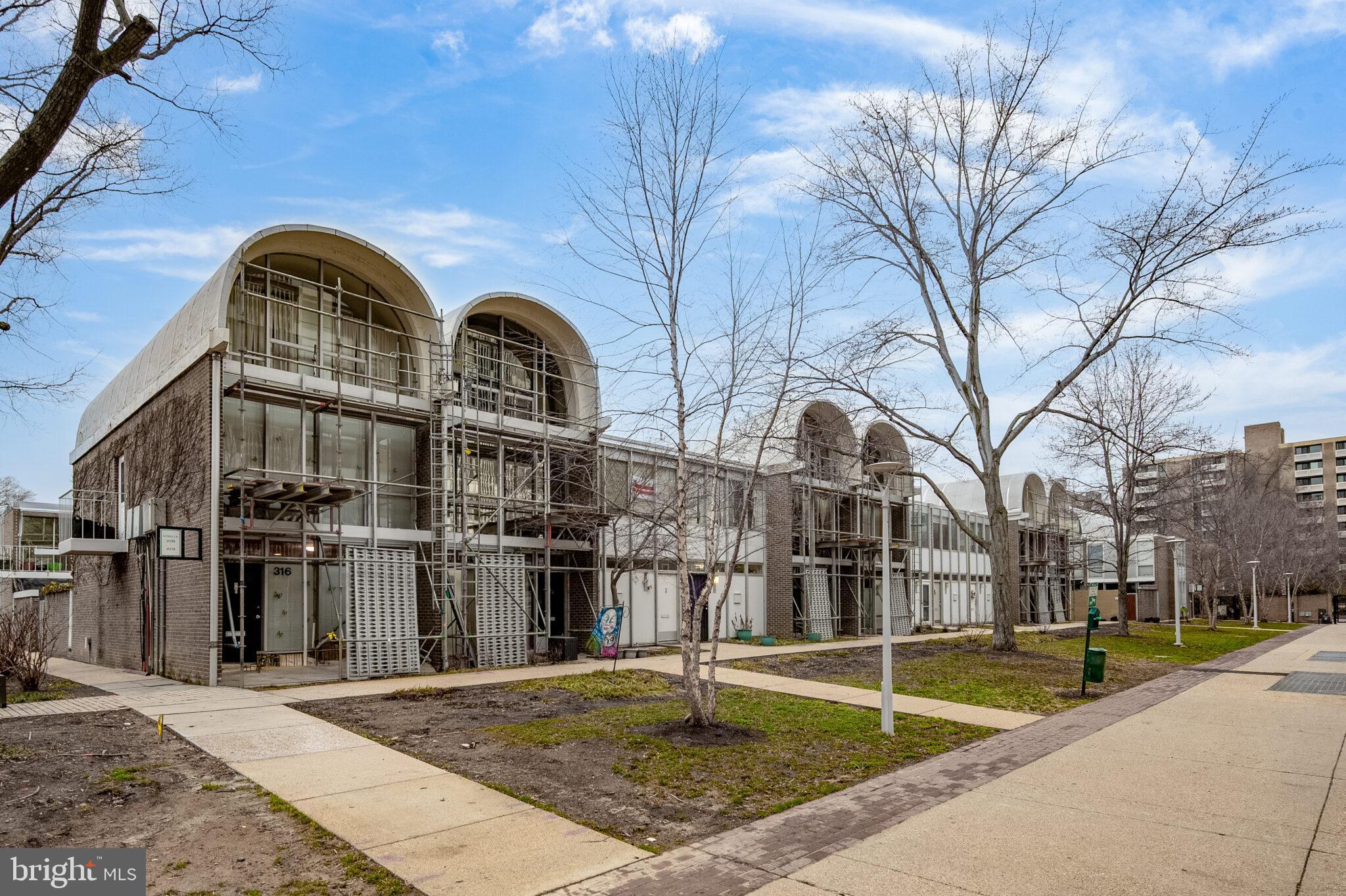 302 N Street Southwest, Unit 302 Washington, DC 20024 - Photo 2 of 68 a view of multiple houses with a yard
