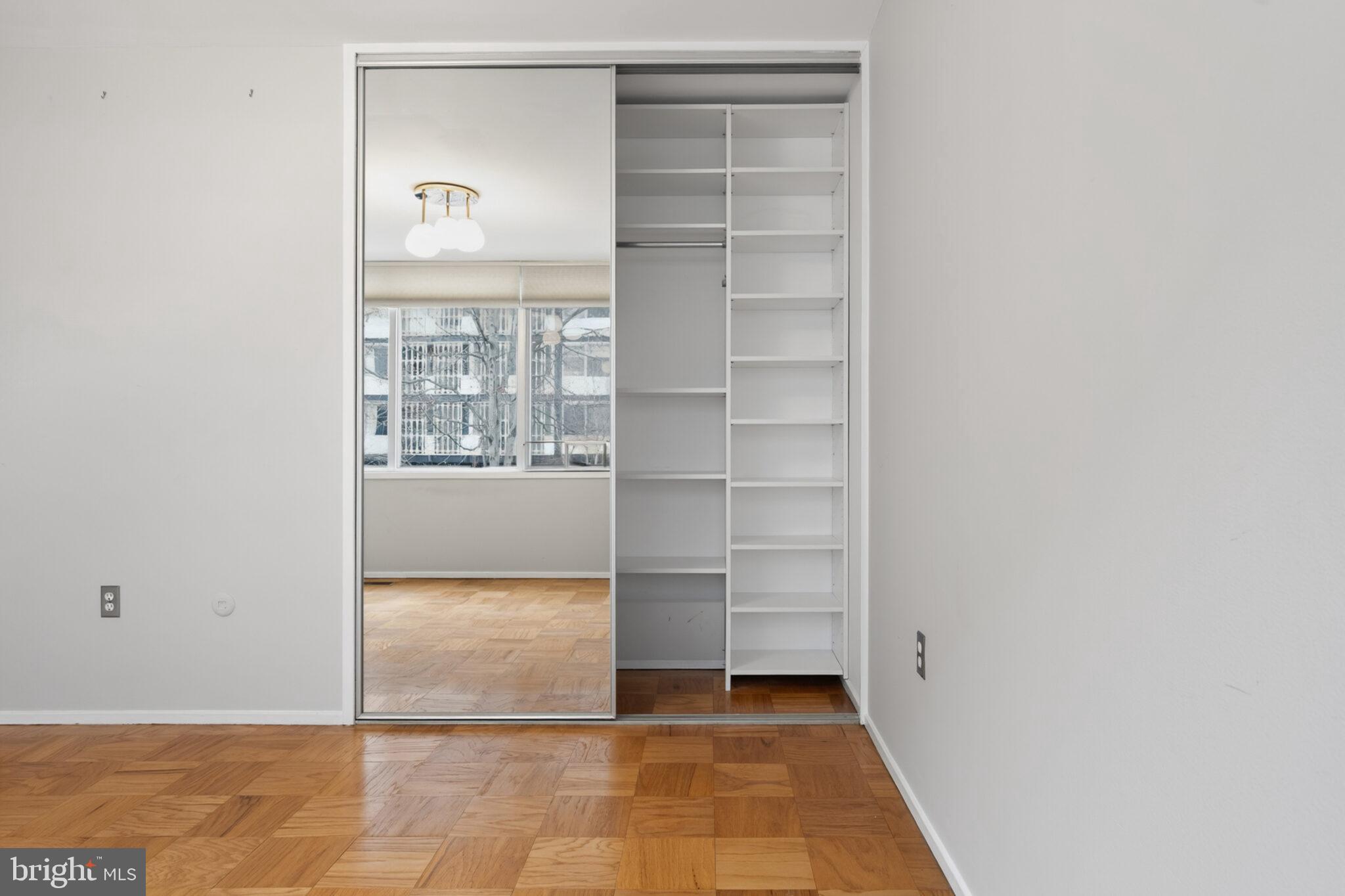 302 N Street Southwest, Unit 302 Washington, DC 20024 - Photo 21 of 68 a view of an empty room with cabinet and a window