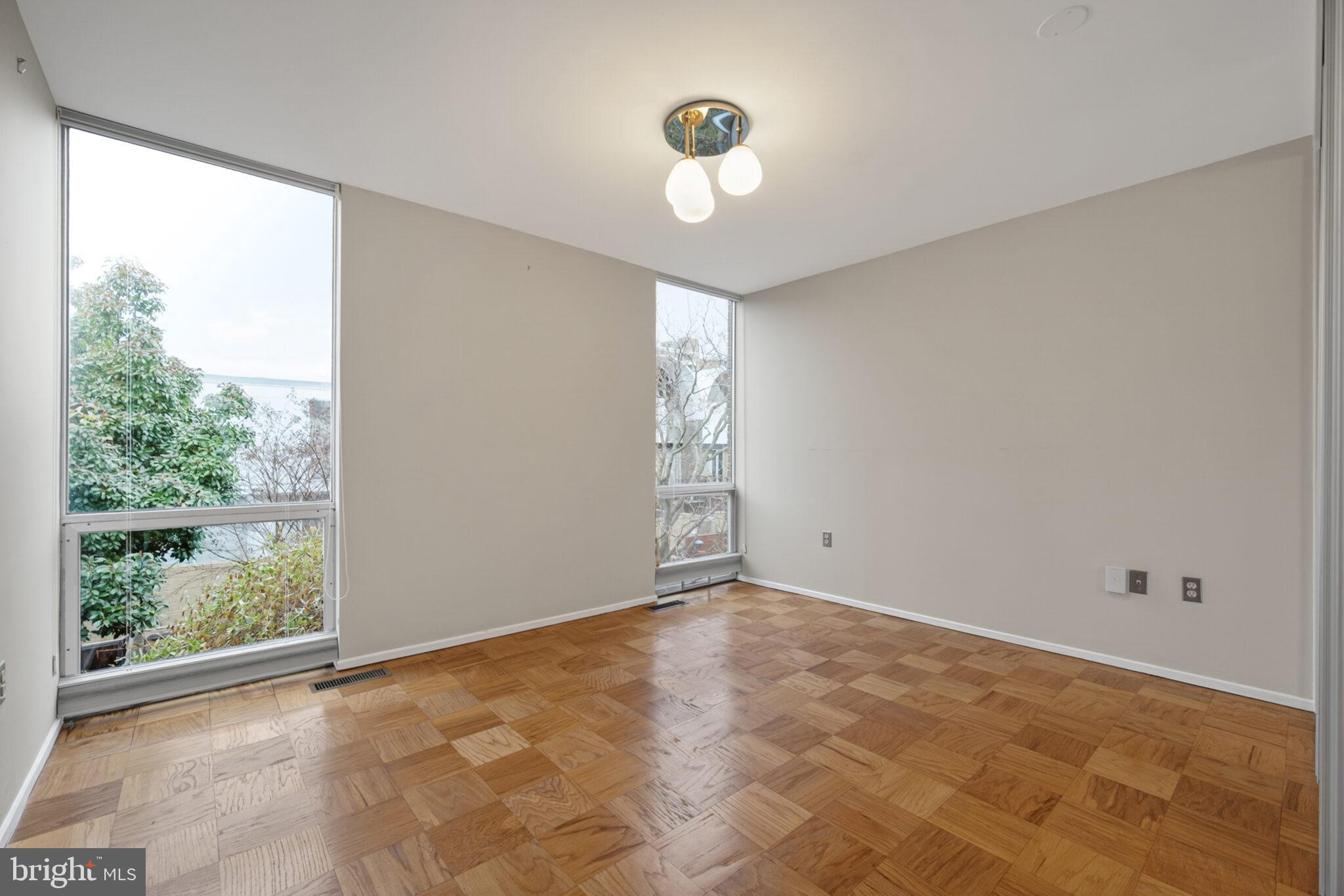 302 N Street Southwest, Unit 302 Washington, DC 20024 - Photo 22 of 68 a view of an empty room with a window
