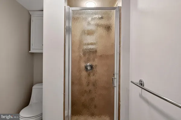 a view of a livingroom with furniture and a window