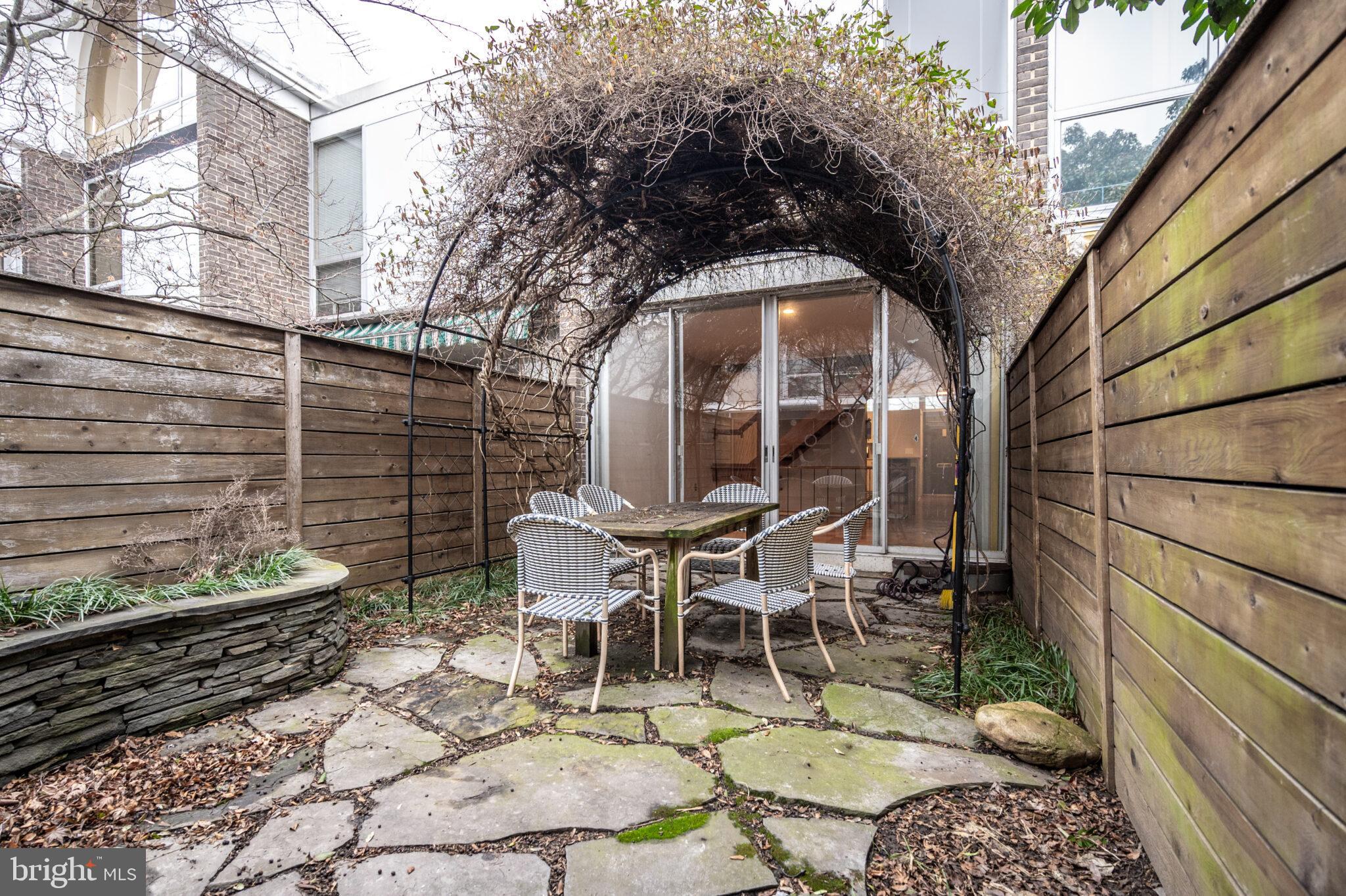 302 N Street Southwest, Unit 302 Washington, DC 20024 - Photo 35 of 68 a view of a chairs and table in backyard