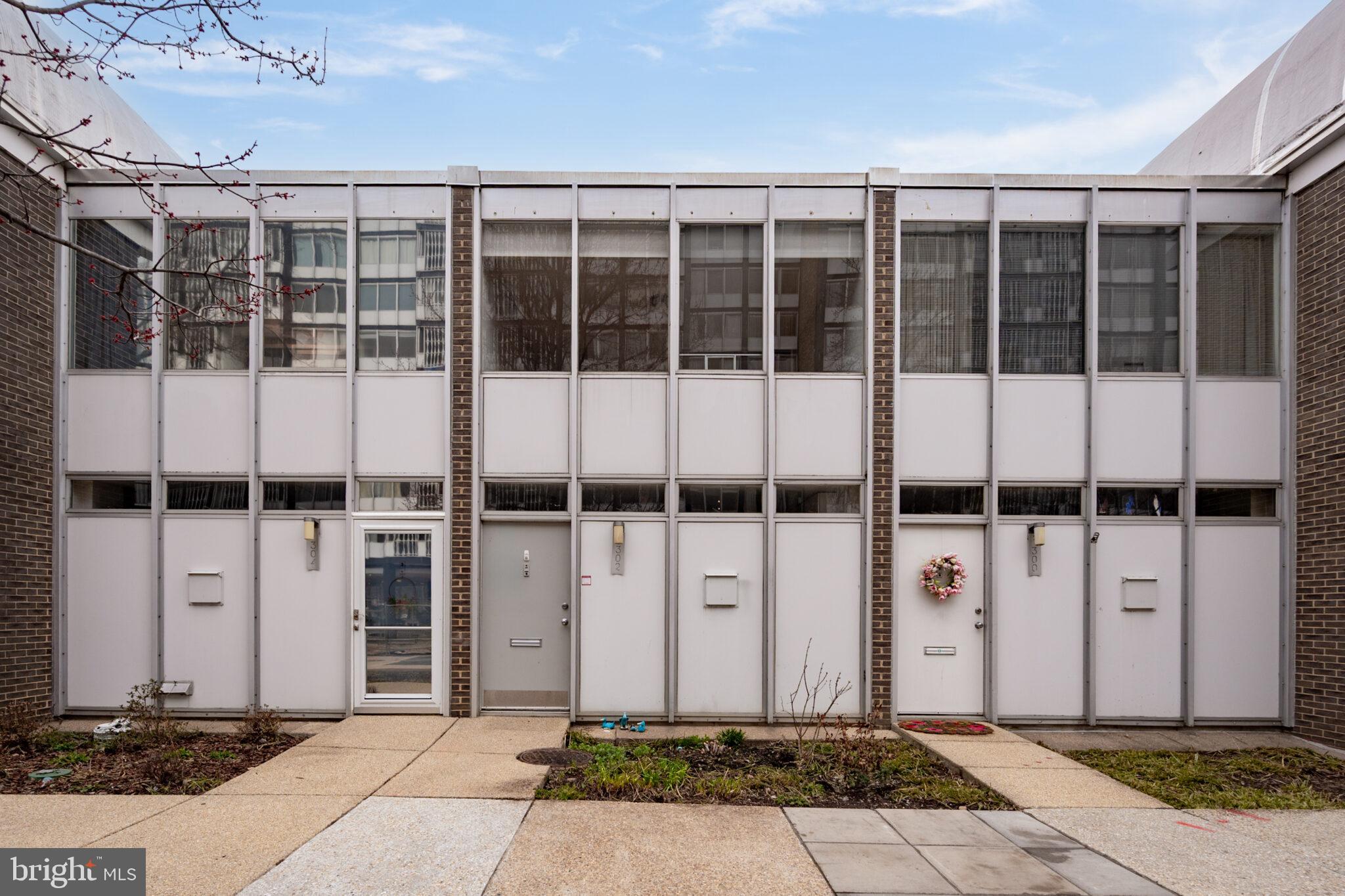 302 N Street Southwest, Unit 302 Washington, DC 20024 - Photo 67 of 68 a front view of a building with glass windows