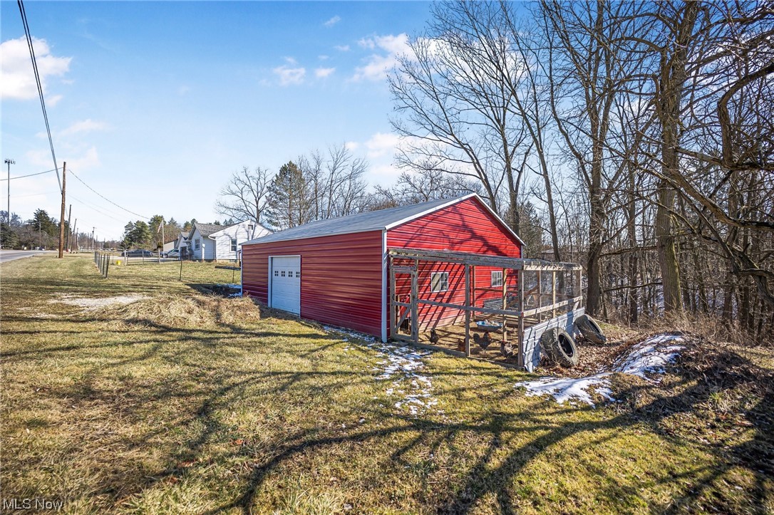 2955 Pearl Road Medina, OH 44256 - Photo 10 of 10 View of outdoor structure with a lawn and a garage
