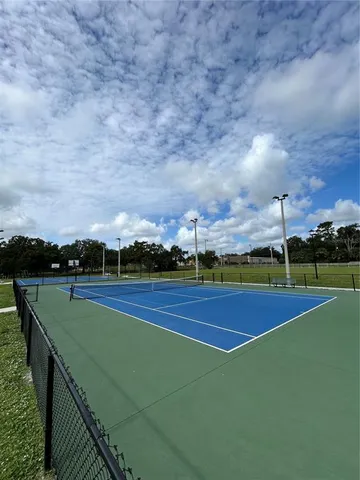 a view of an outdoor space and tennis court