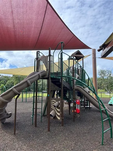 a view of a roof deck with a table and chairs under an umbrella