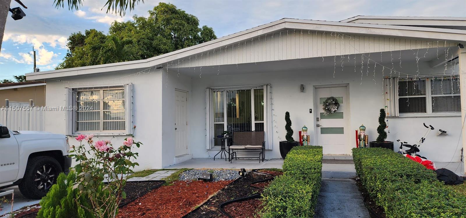 12441 Southwest 190th Terrace Miami, FL 33177 - Photo 1 of 24 a front view of a house with a yard