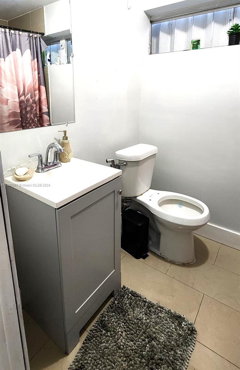 12441 Southwest 190th Terrace Miami, FL 33177 - Photo 19 of 24 a bathroom with a sink and a toilet
