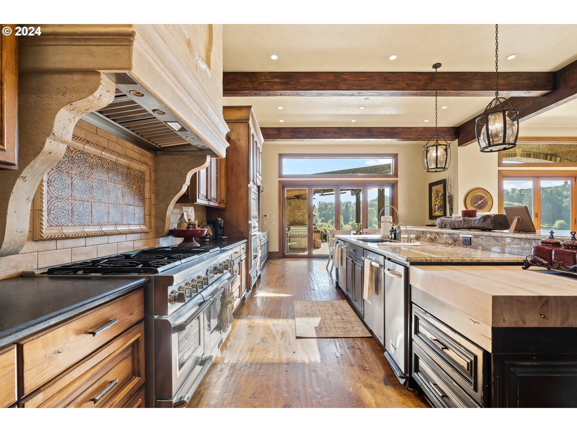 12780 South Fielding Road Lake Oswego, OR 97034 - Photo 15 of 48 a kitchen with stainless steel appliances granite countertop a stove and a sink
