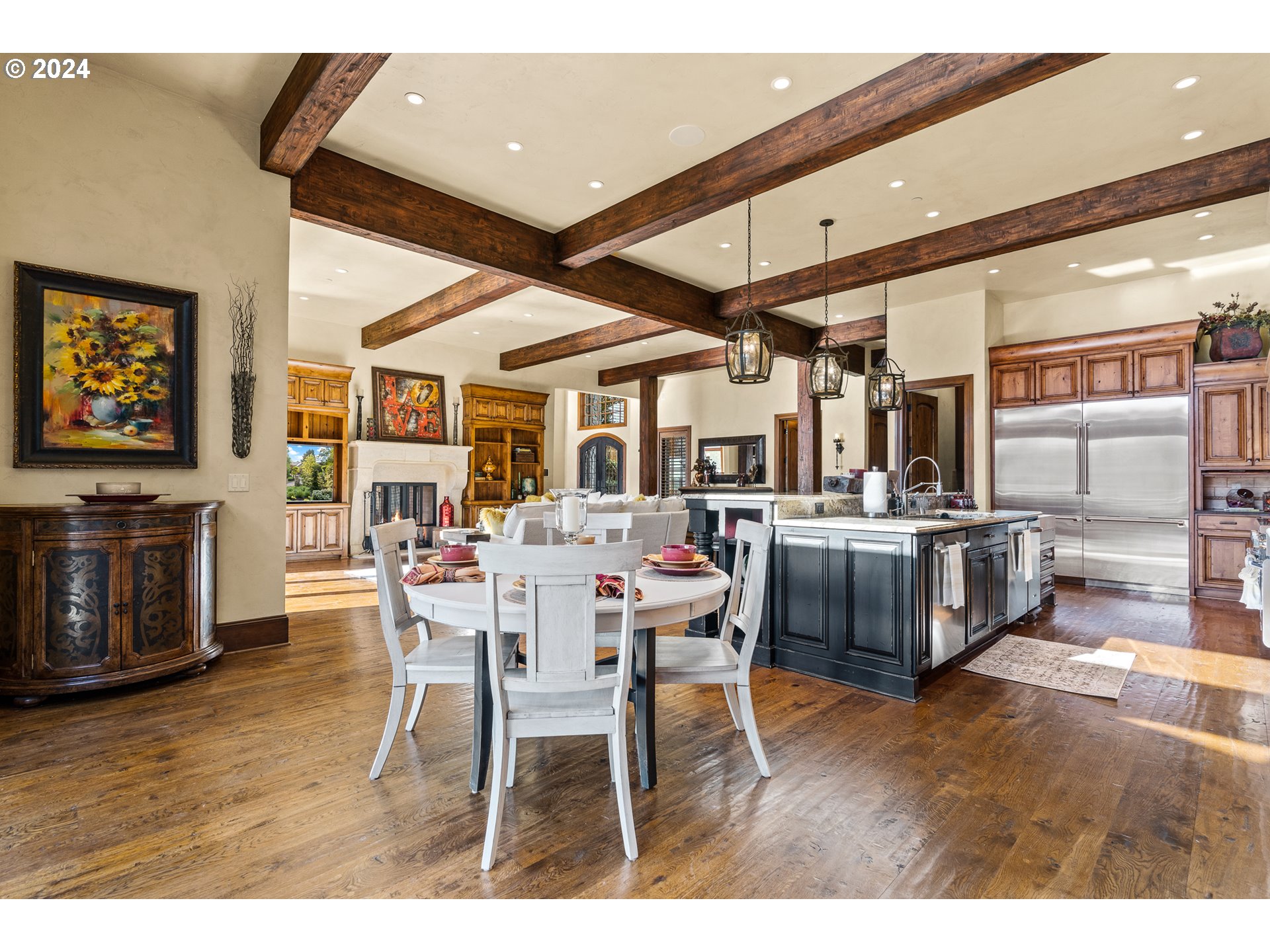12780 South Fielding Road Lake Oswego, OR 97034 - Photo 16 of 48 a dining hall with stainless steel appliances kitchen island granite countertop a table chairs and a large window