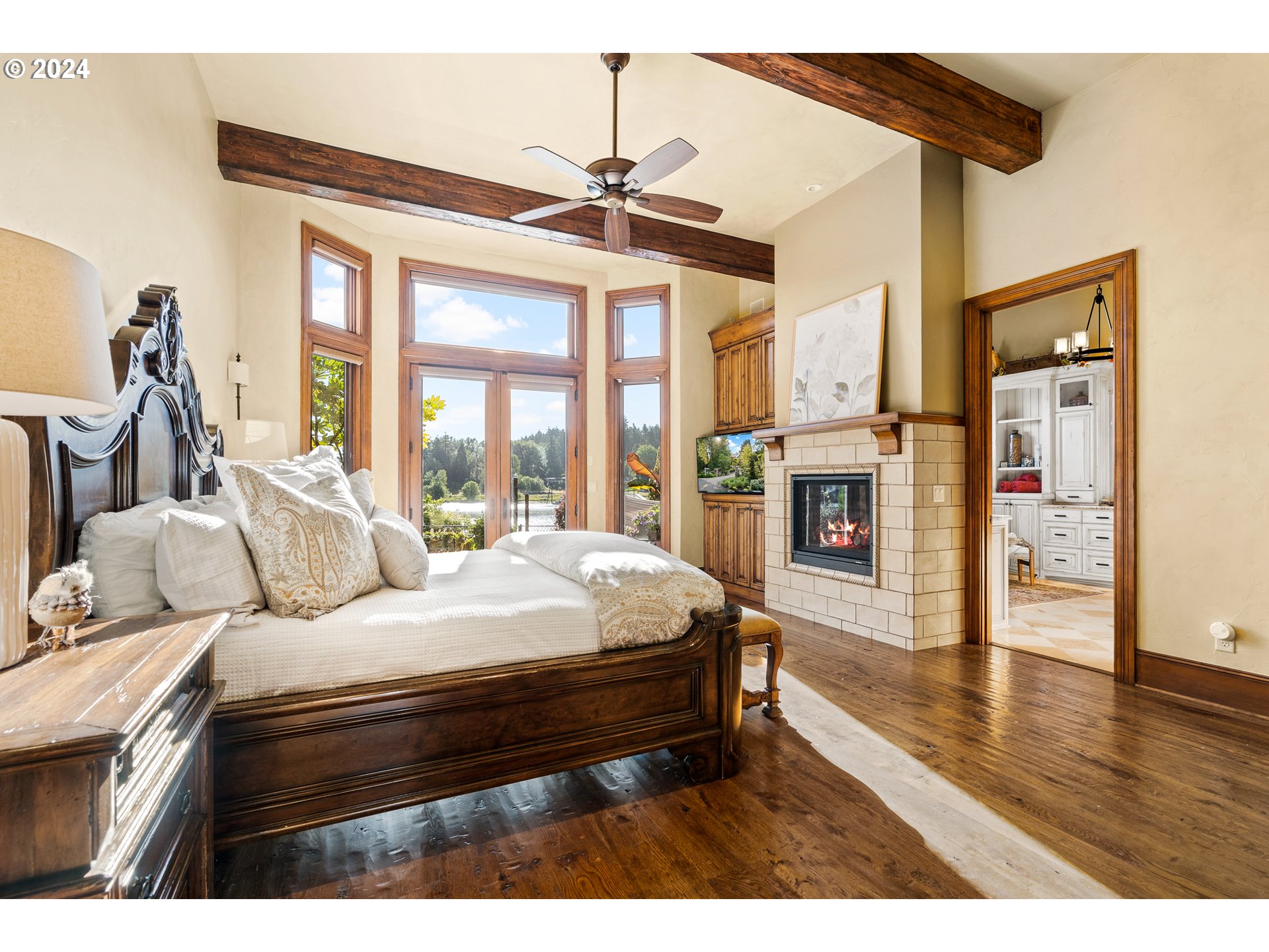 12780 South Fielding Road Lake Oswego, OR 97034 - Photo 20 of 48 a bed room with a bed and a chandelier