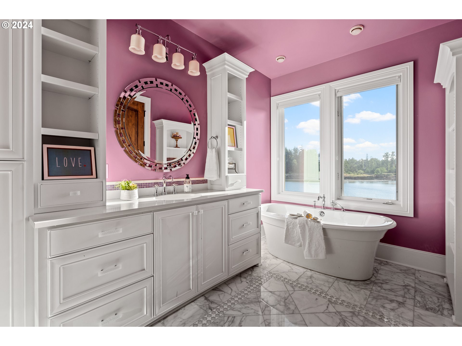12780 South Fielding Road Lake Oswego, OR 97034 - Photo 32 of 48 a spacious bathroom with a granite countertop sink and a large mirror