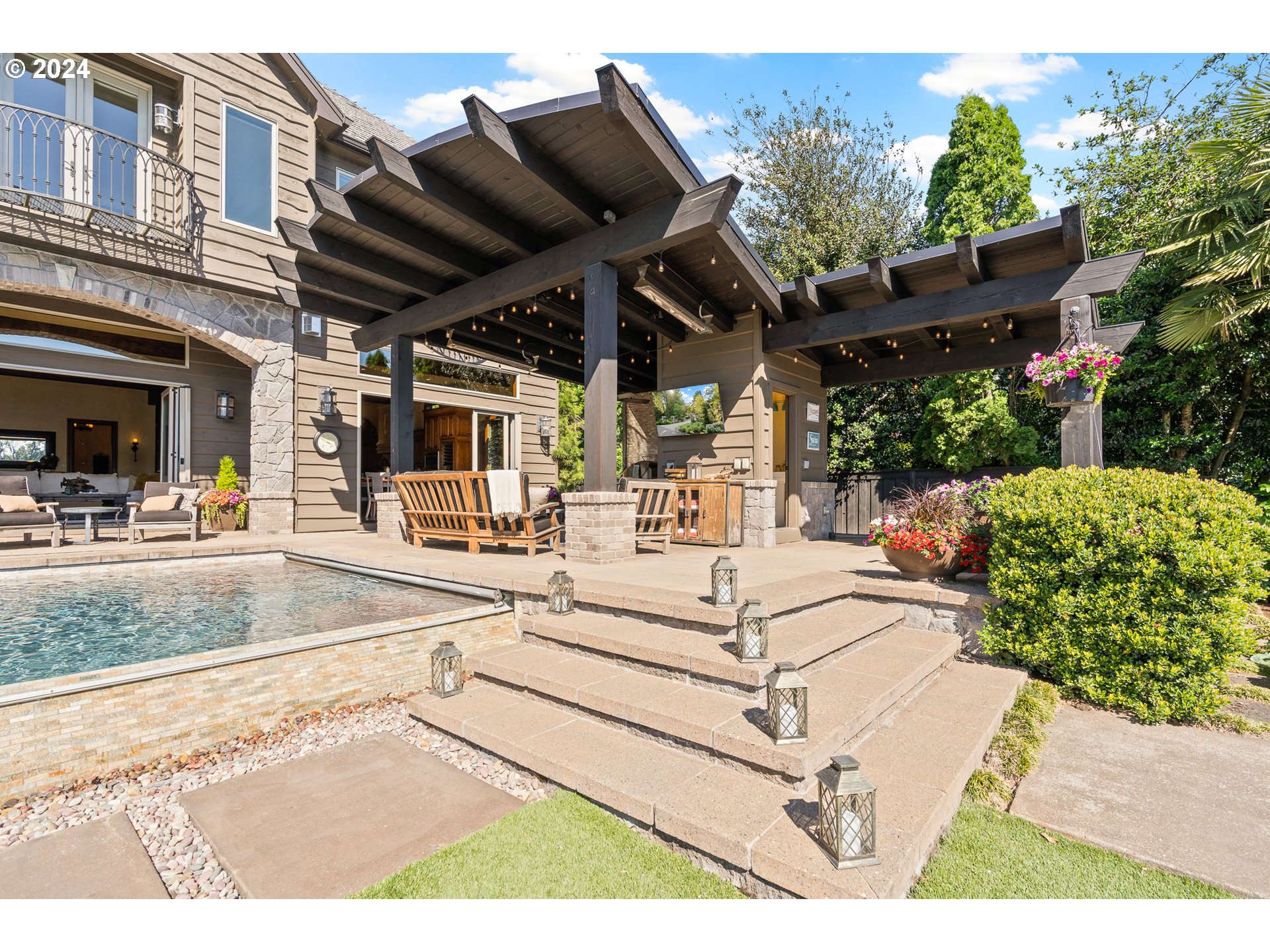12780 South Fielding Road Lake Oswego, OR 97034 - Photo 44 of 48 a view of a patio with a table and chairs and potted plants