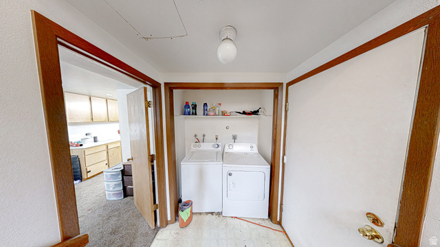 630 1100 West Provo, UT 84601 - Photo 37 of 64 Dedicated laundry area featuring a white top-load washing machine and a white dryer