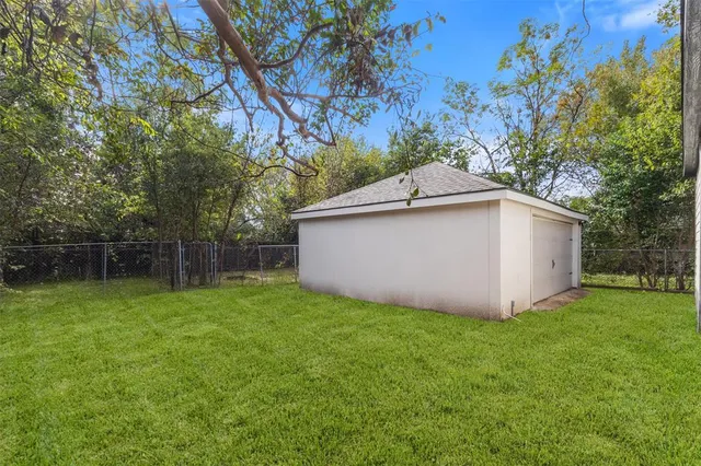 a view of a backyard with a small cabin