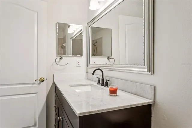 a bathroom with a sink and a mirror