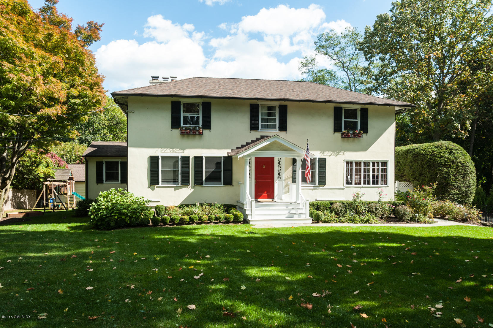 a front view of a house with a yard
