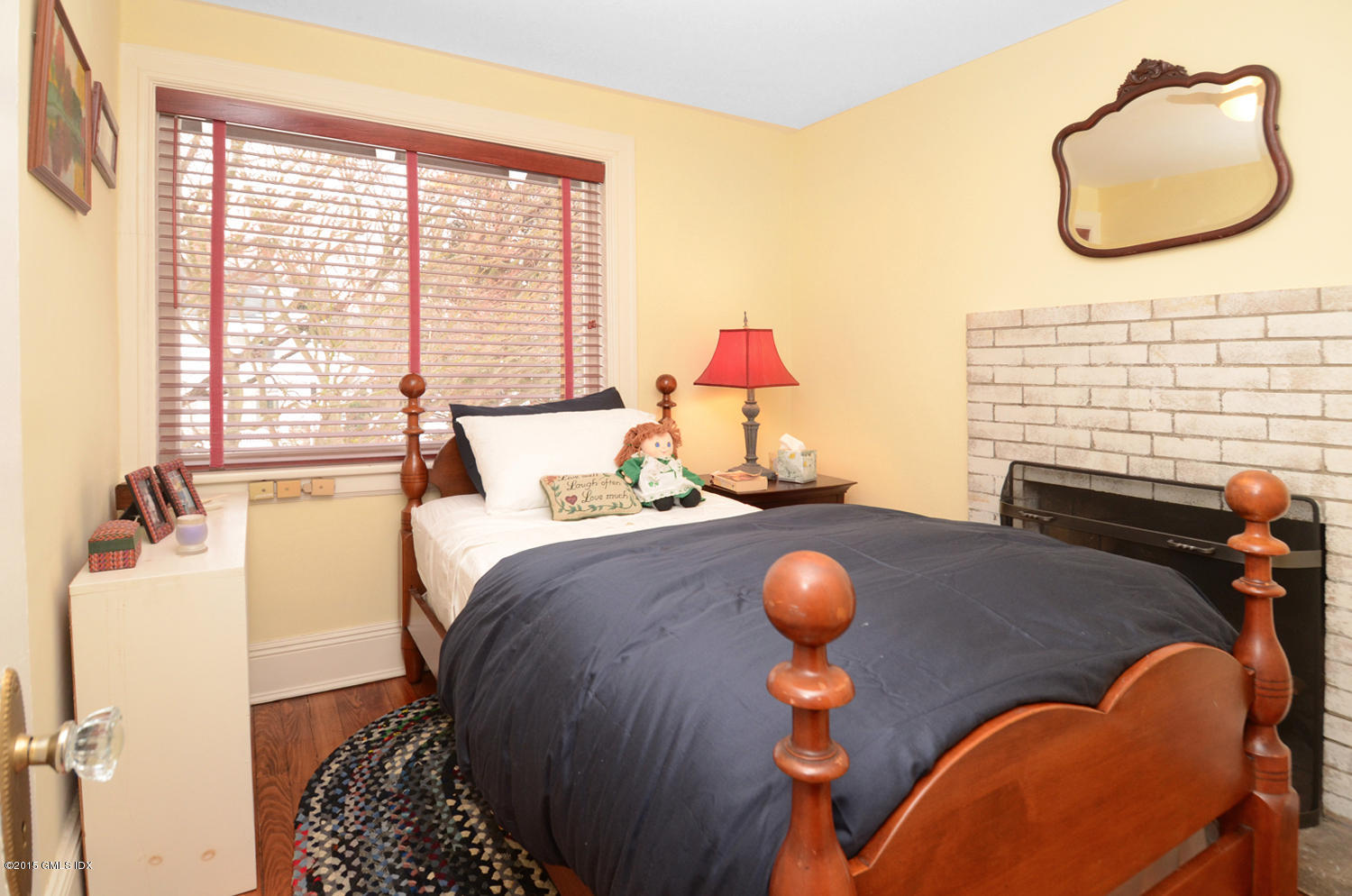 49 Indian Field Road Greenwich, CT 06830 - Photo 23 of 28 a bedroom with a bed and a chair