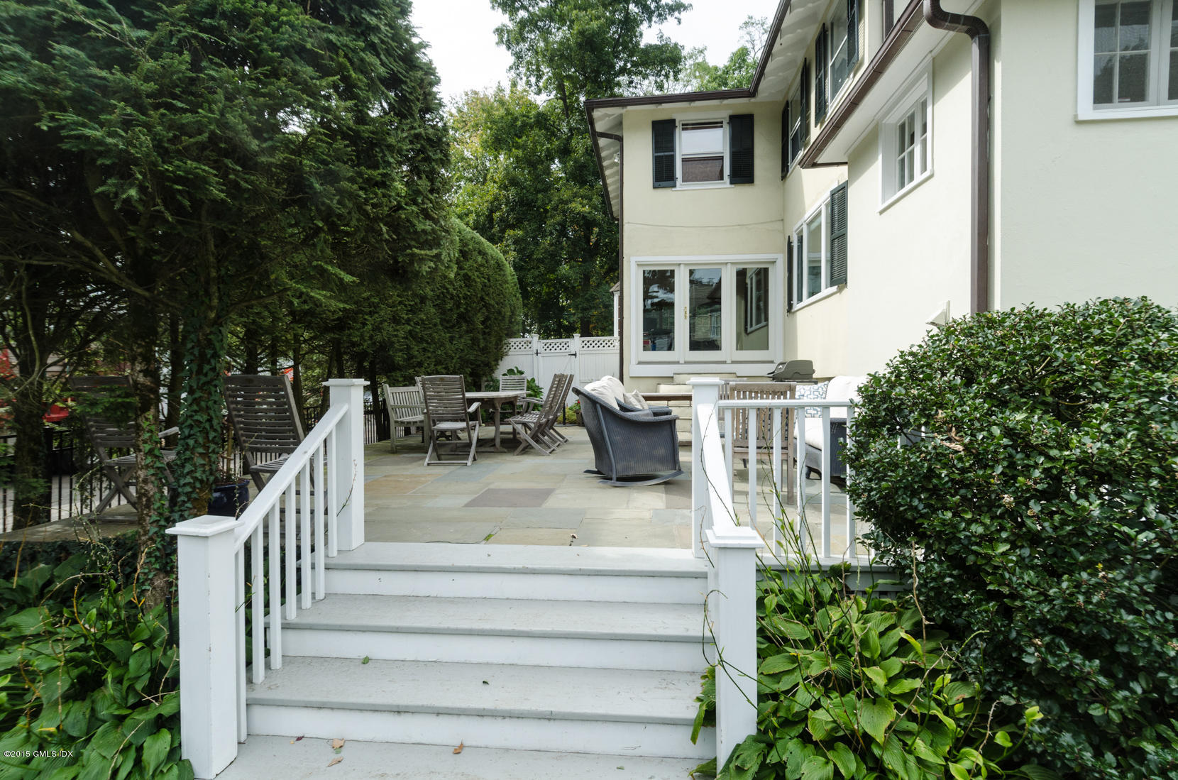 49 Indian Field Road Greenwich, CT 06830 - Photo 26 of 28 a view of house with yard outdoor seating and plants