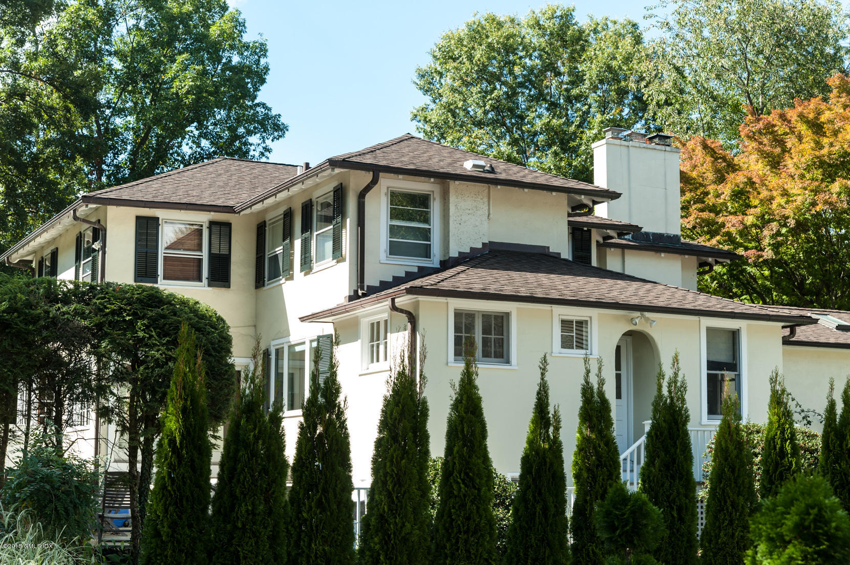49 Indian Field Road Greenwich, CT 06830 - Photo 27 of 28 a front view of a house with a garden