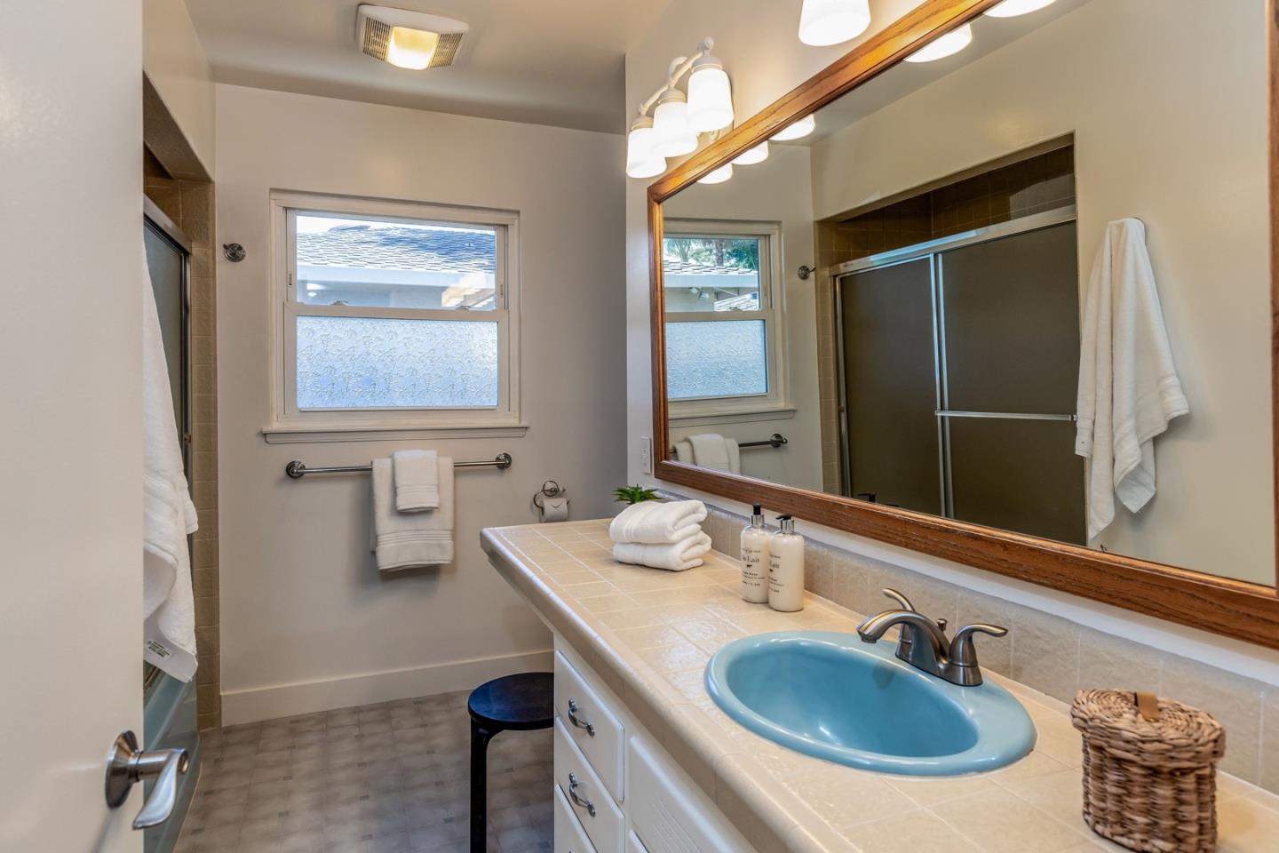 866 Stonehurst Way Campbell, CA 95008 - Photo 12 of 18 a bathroom with a sink and a mirror
