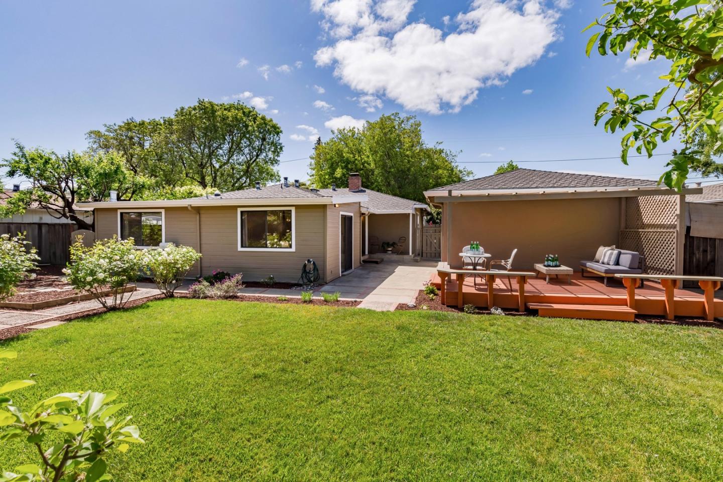 866 Stonehurst Way Campbell, CA 95008 - Photo 15 of 18 a view of a house with backyard sitting area and garden
