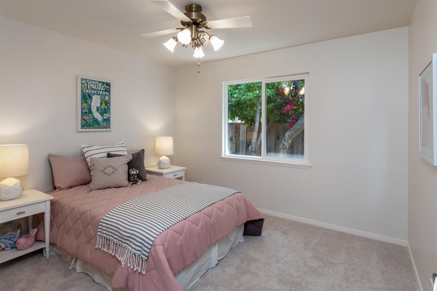 866 Stonehurst Way Campbell, CA 95008 - Photo 10 of 18 a bedroom with a bed and a chandelier