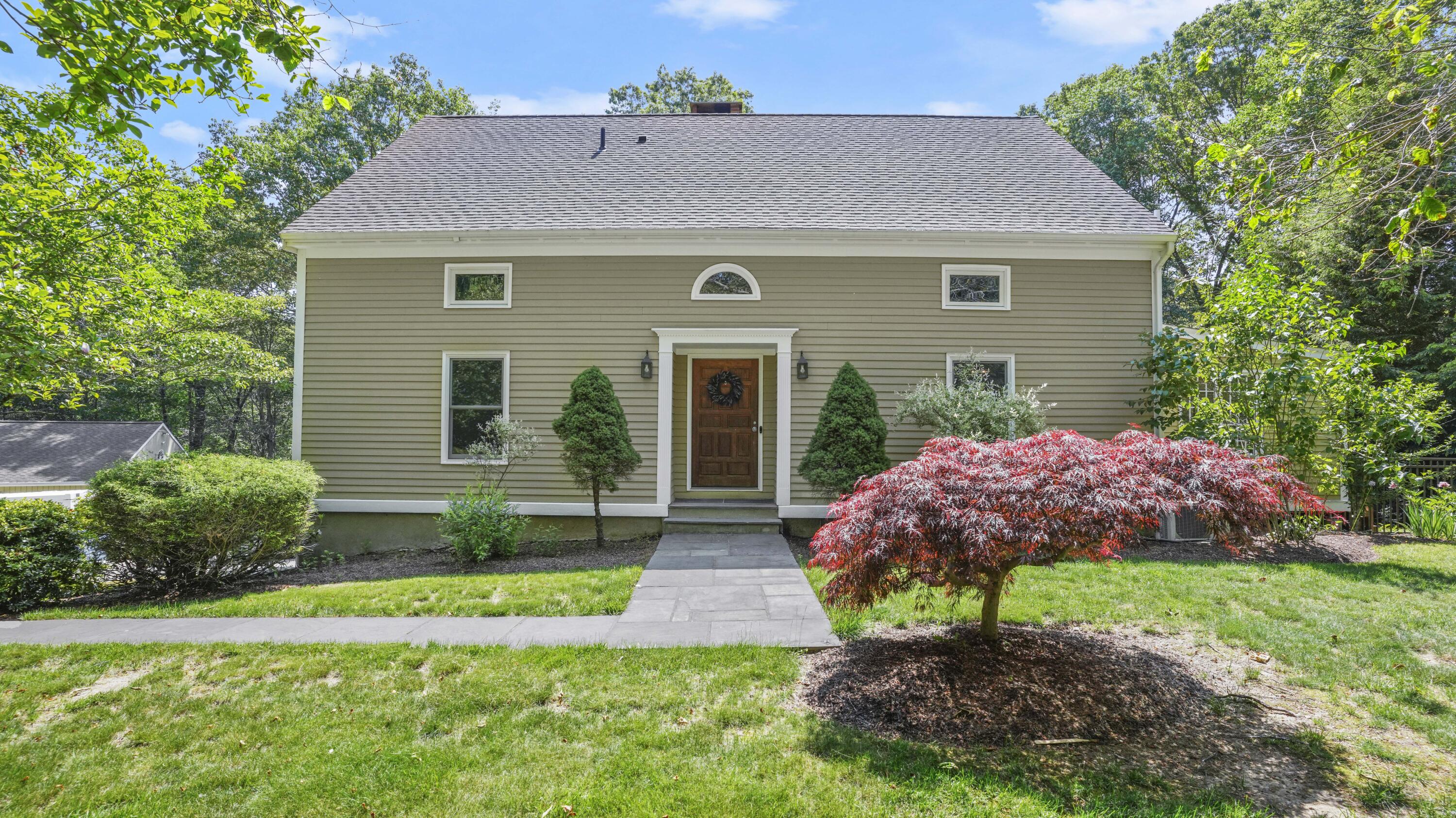 17 Middlebrook Pond Road Redding, CT 06896 - Photo 1 of 40 a front view of a house with garden