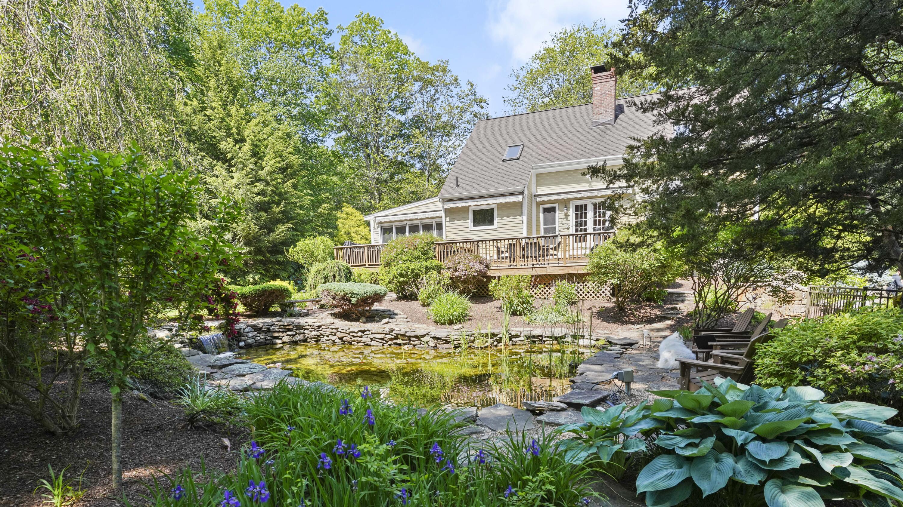 17 Middlebrook Pond Road Redding, CT 06896 - Photo 27 of 40 a view of a house with pool and sitting area
