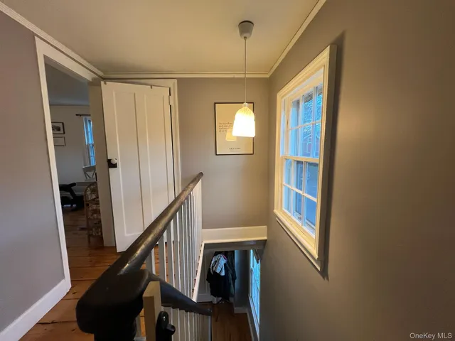 a bathroom with a sink mirror and a bathtub