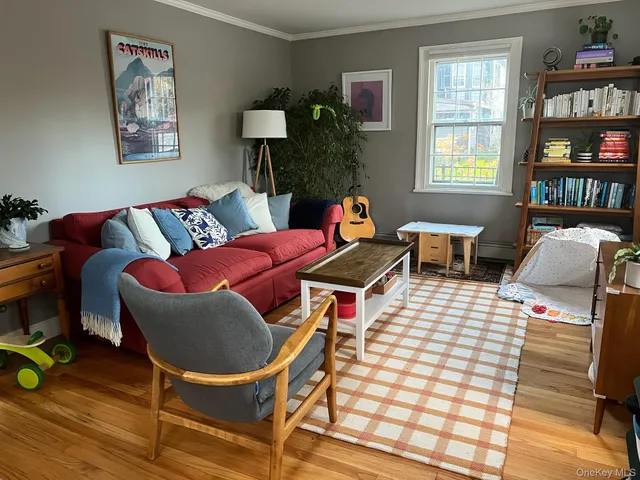 a bedroom with furniture and a book shelf