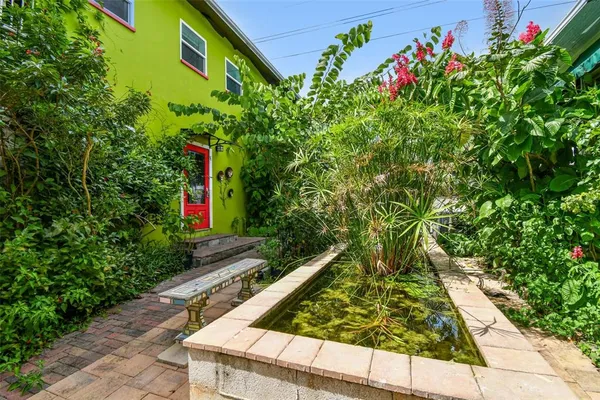 a view of a porch with a table and a chair