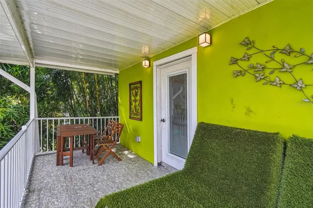 a view of a porch with wooden floor