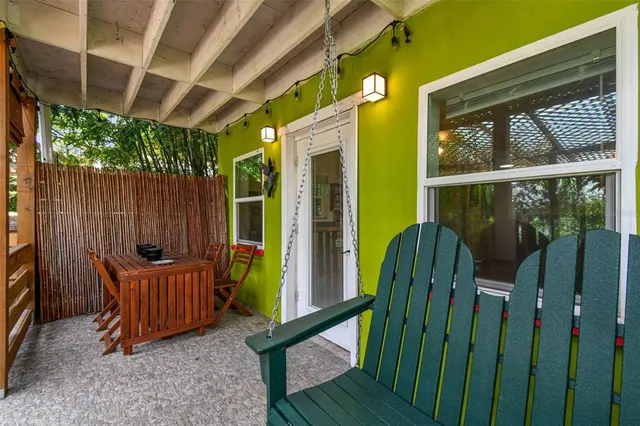 a view of a chairs and table in the patio