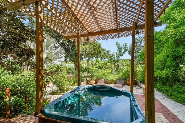 a view of a backyard with sitting area