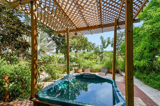 a view of a backyard with sitting area