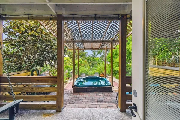 a bedroom with bed and wooden floor