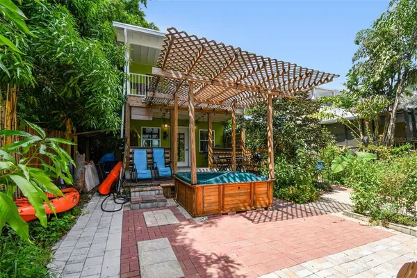 a bedroom with a bed dresser and a window