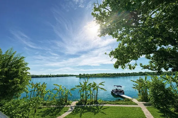 a view of a lake with a big yard
