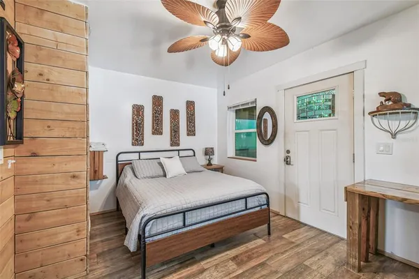a room with stainless steel appliances kitchen island granite countertop a sink and a stove next to a window