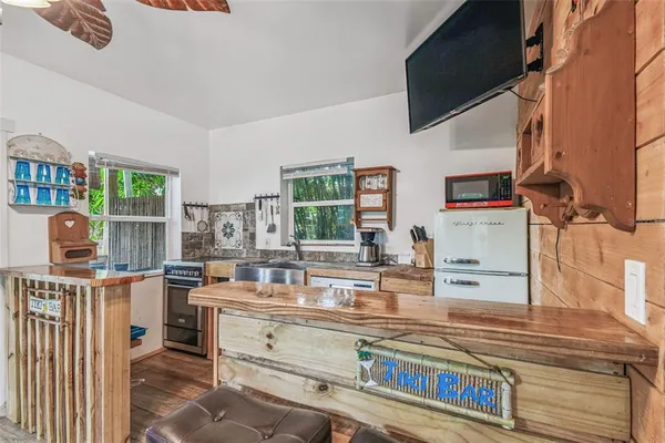 a view of backyard with patio