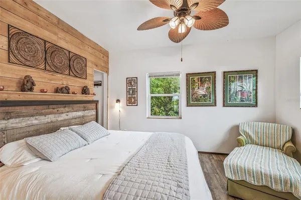 an aerial view of a residential houses with yard