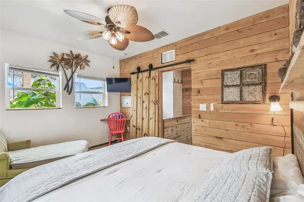 a view of a chairs and table in a backyard
