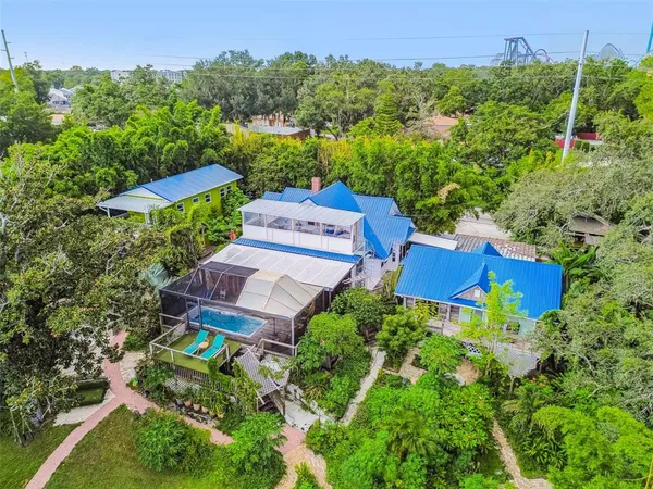 a view of a back yard of the house and a fountain