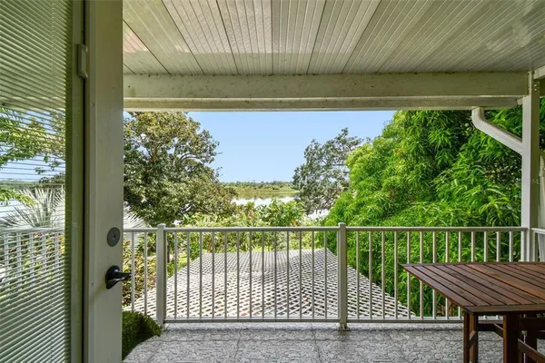 a kitchen with stainless steel appliances white cabinets and wooden floors