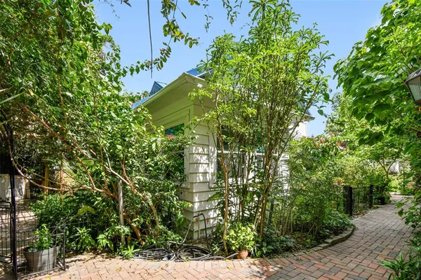 a bathroom with a sink a toilet and shower curtain