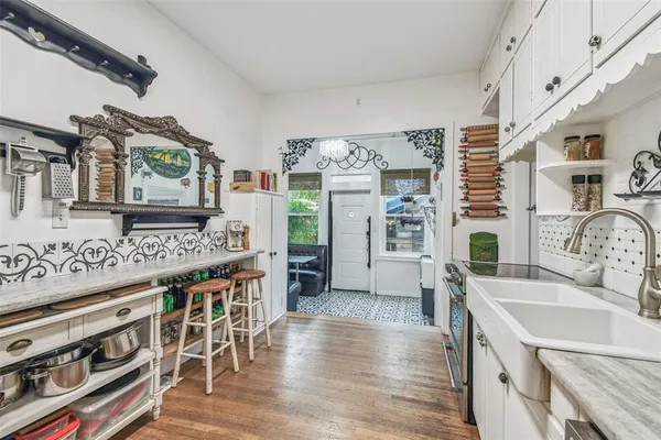 a bathroom with a tub shower and sink