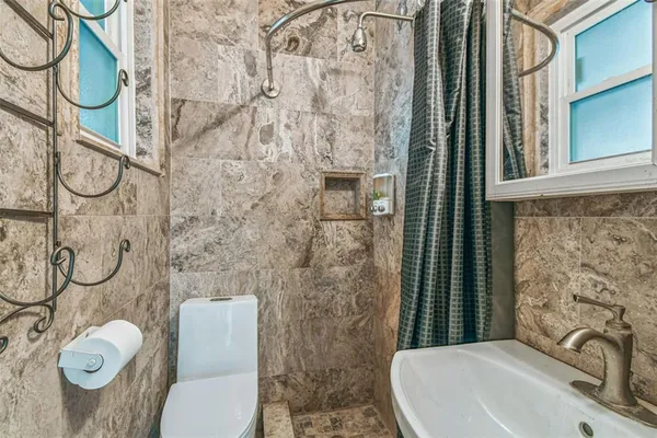a kitchen with stainless steel appliances granite countertop a sink and cabinets